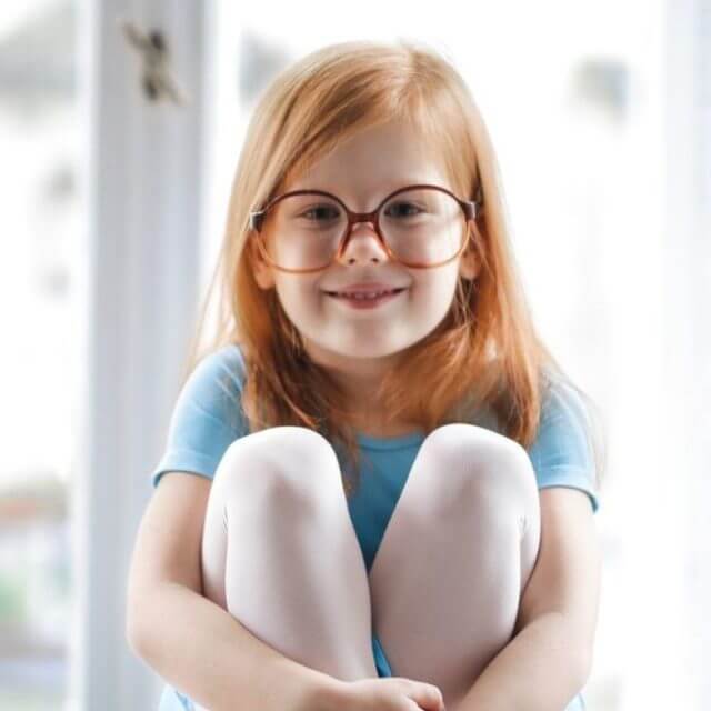 child girl redhead smiling glasses blue ballet dress 1000px.jpg